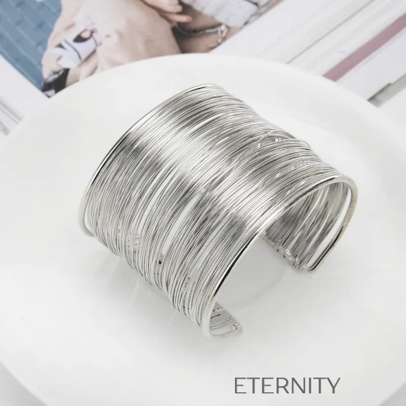 Brazaletes tipo cuff dorado y plateado con diseño de alambre Brazaletes Dorado Unica Acero Inoxidable ETERNITY