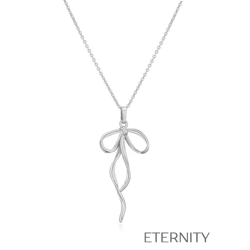 Colección de Collares Enchanted Bow con Dijes de Lazo en Perlas y Oro Cadenas Dorado Unica Acero Inoxidable ETERNITY