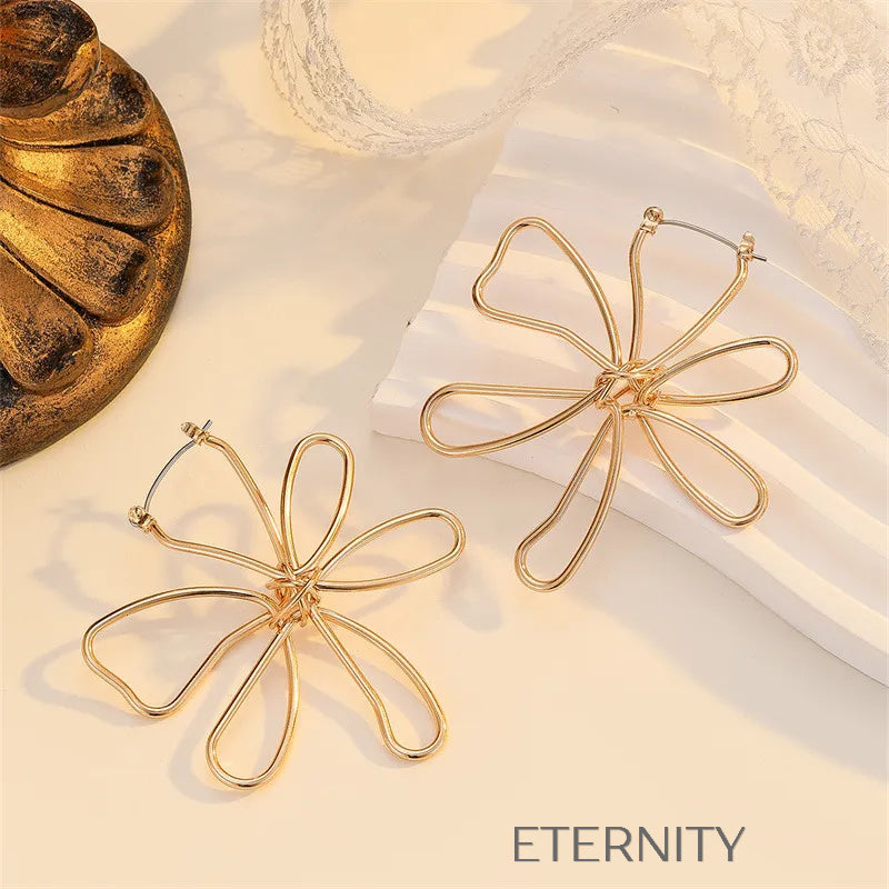 Aretes dorados con diseño artístico floral Zarcillos Dorado Unica Acero Inoxidable ETERNITY