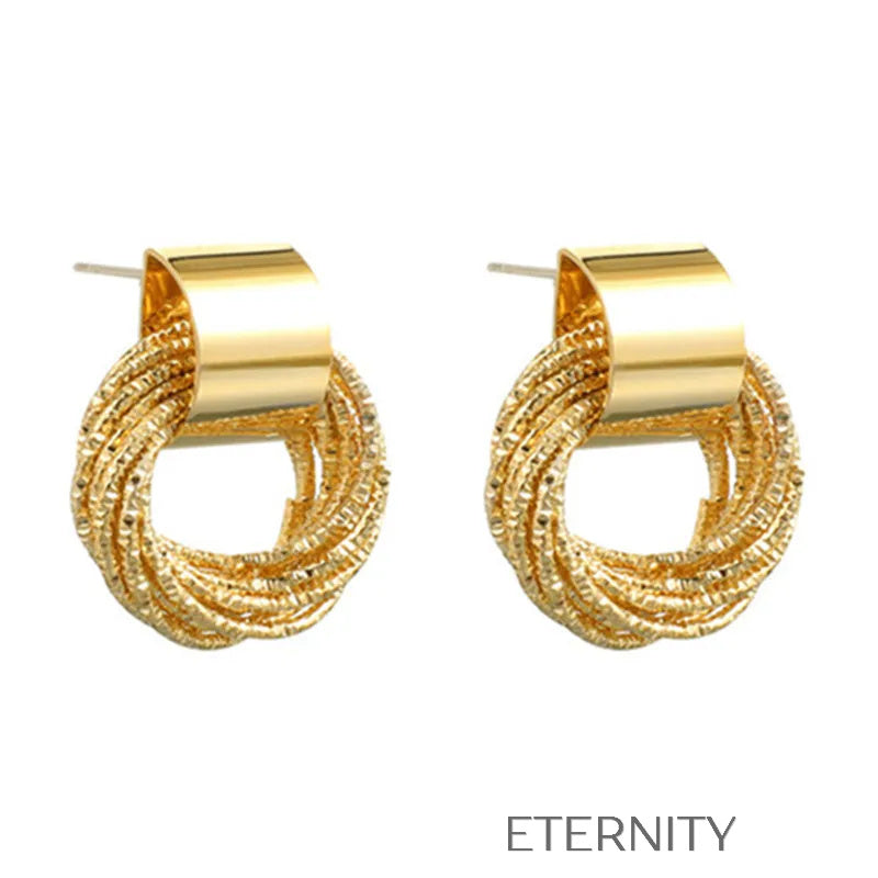 Zarcillos de Botón Golden Loop con Diseño Entrelazado en Oro y Plata Zarcillos Dorado Unica Acero Inoxidable ETERNITY