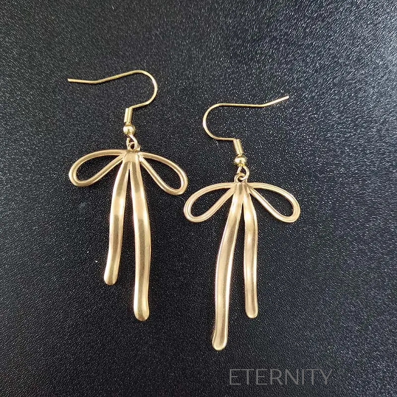 Zarcillos de Lazo Eternal Bow en Oro con Textura Fluida Zarcillos Dorado Unica Acero Inoxidable ETERNITY