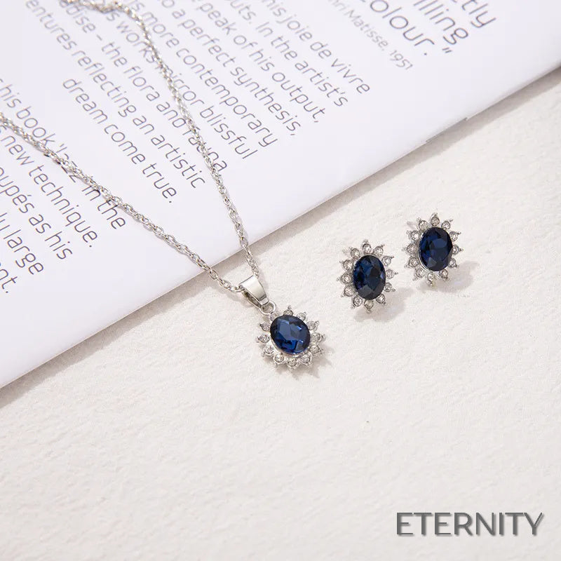 Set de Collar y Pendientes Plateados con Zafiro Tanzanita Ovalado y Halo de Rhinestones - ETERNITY