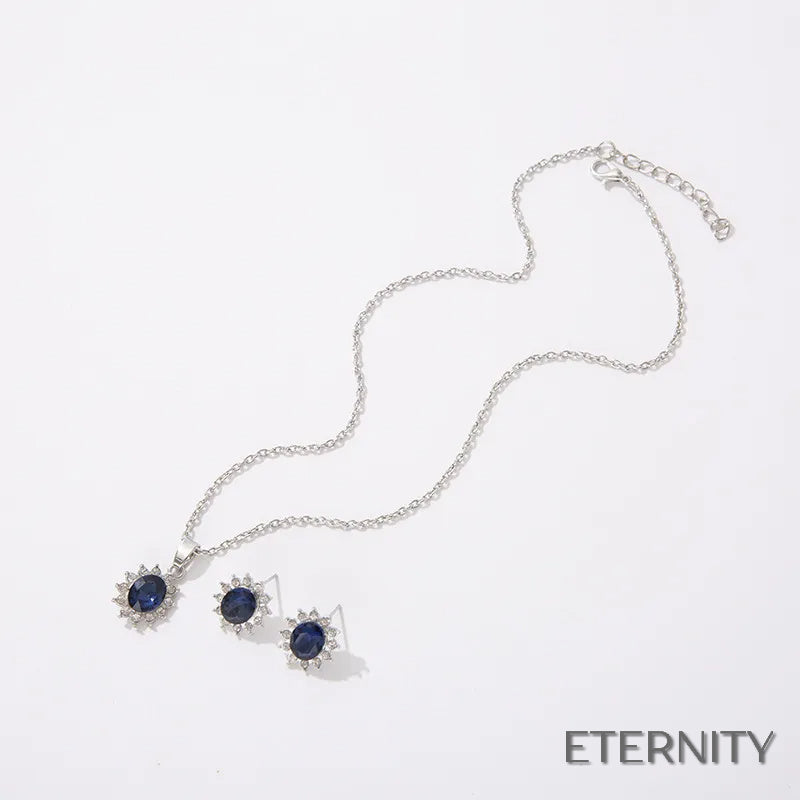 Set de Collar y Pendientes Plateados con Zafiro Tanzanita Ovalado y Halo de Rhinestones - ETERNITY