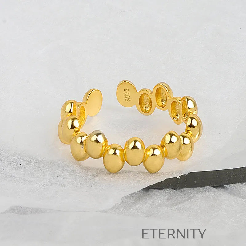 Brazalete Golden Pebble Orgánico  Anillos Dorado Ajustable Acero Inoxidable  ETERNITY