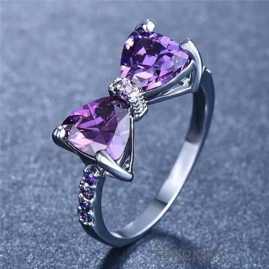 Anillo Amethyst Bow de Lazo con Cristales Violetas y Banda Empedrada  Anillos Purpura 7 Acero Inoxidable  ETERNITY