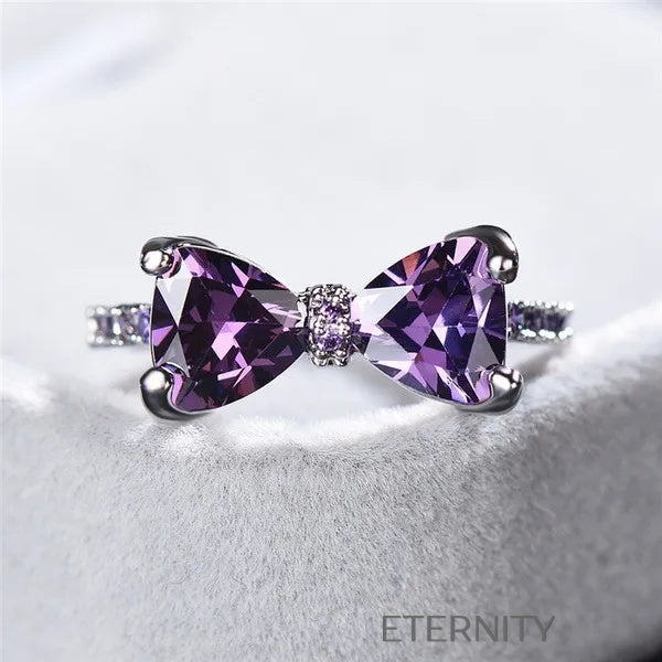 Anillo Amethyst Bow de Lazo con Cristales Violetas y Banda Empedrada  Anillos Purpura 7 Acero Inoxidable  ETERNITY