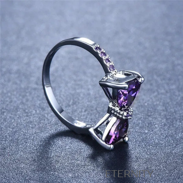 Anillo Amethyst Bow de Lazo con Cristales Violetas y Banda Empedrada  Anillos Purpura 7 Acero Inoxidable  ETERNITY