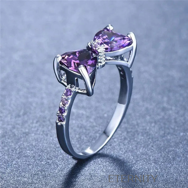 Anillo Amethyst Bow de Lazo con Cristales Violetas y Banda Empedrada  Anillos Purpura 7 Acero Inoxidable  ETERNITY