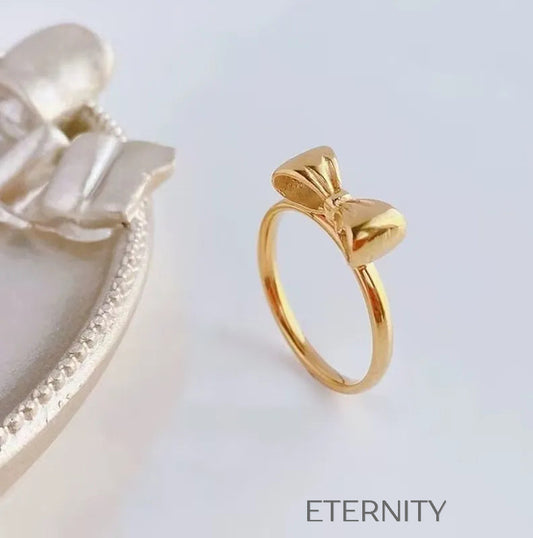 Anillo Fino Sweet Bow con Diseño de Lazo en Oro Pulido  Anillos Dorado 7 Acero Inoxidable  ETERNITY
