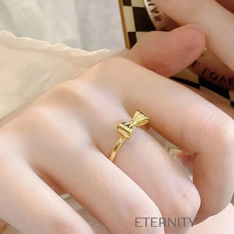 Anillo Fino Sweet Bow con Diseño de Lazo en Oro Pulido  Anillos Dorado 7 Acero Inoxidable  ETERNITY