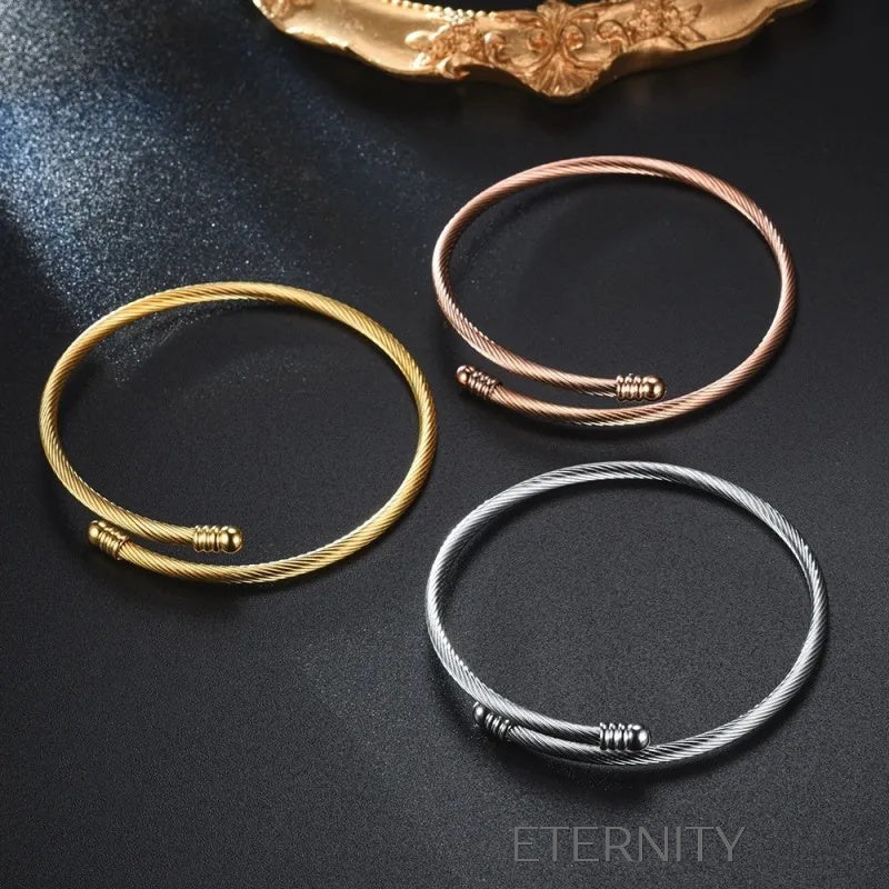 Brazaletes abiertos en cable metálico dorado plateado y rosado Brazaletes Dorado Unica Acero Inoxidable  ETERNITY