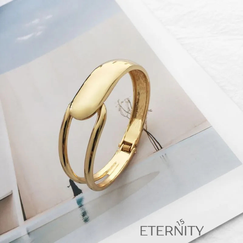 Brazalete Rígido Unity Loop con Diseño Orgánico y Cierre de Bisagra  Brazaletes Dorado Unica Acero Inoxidable  ETERNITY