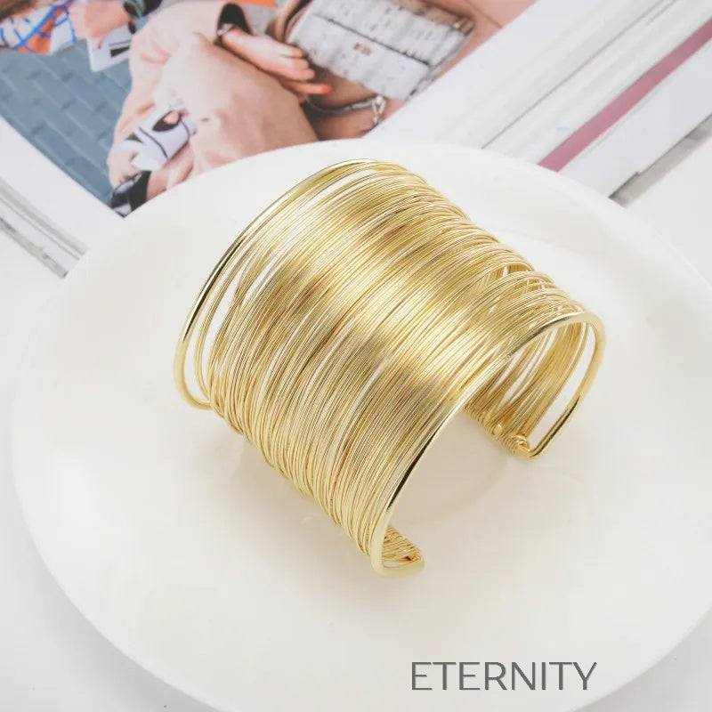 Brazaletes tipo cuff dorado y plateado con diseño de alambre Brazaletes Dorado Unica Acero Inoxidable  ETERNITY