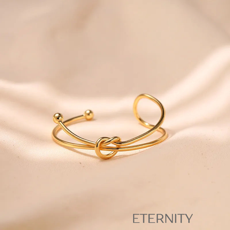 Brazalete Rígido Knot con Nudo Central en Oro  Brazaletes Dorado Unica Acero Inoxidable  ETERNITY