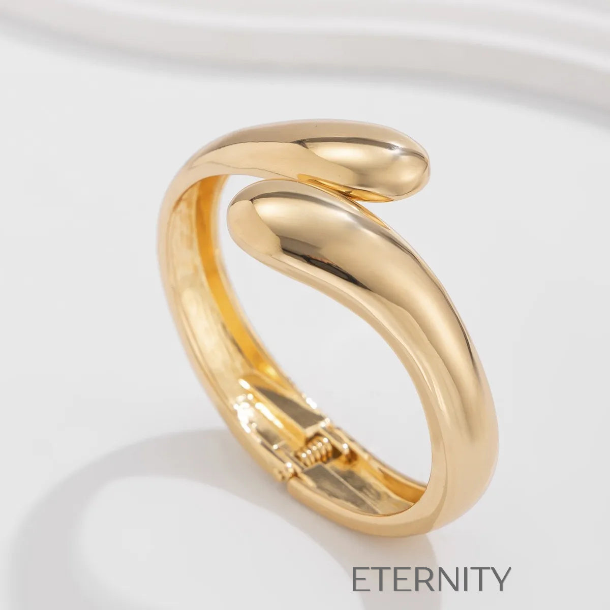 Brazaletes dorados y plateados con diseño escultórico moderno Brazaletes Dorado Unica Acero Inoxidable  ETERNITY