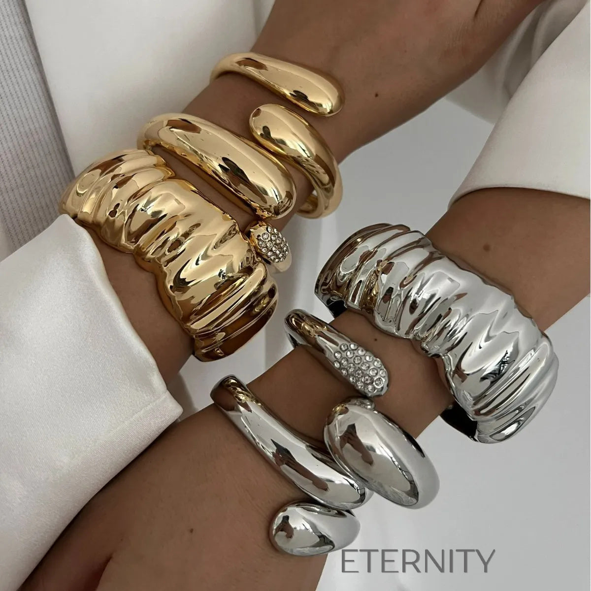 Brazaletes dorados y plateados con diseño escultórico moderno Brazaletes Dorado Unica Acero Inoxidable  ETERNITY