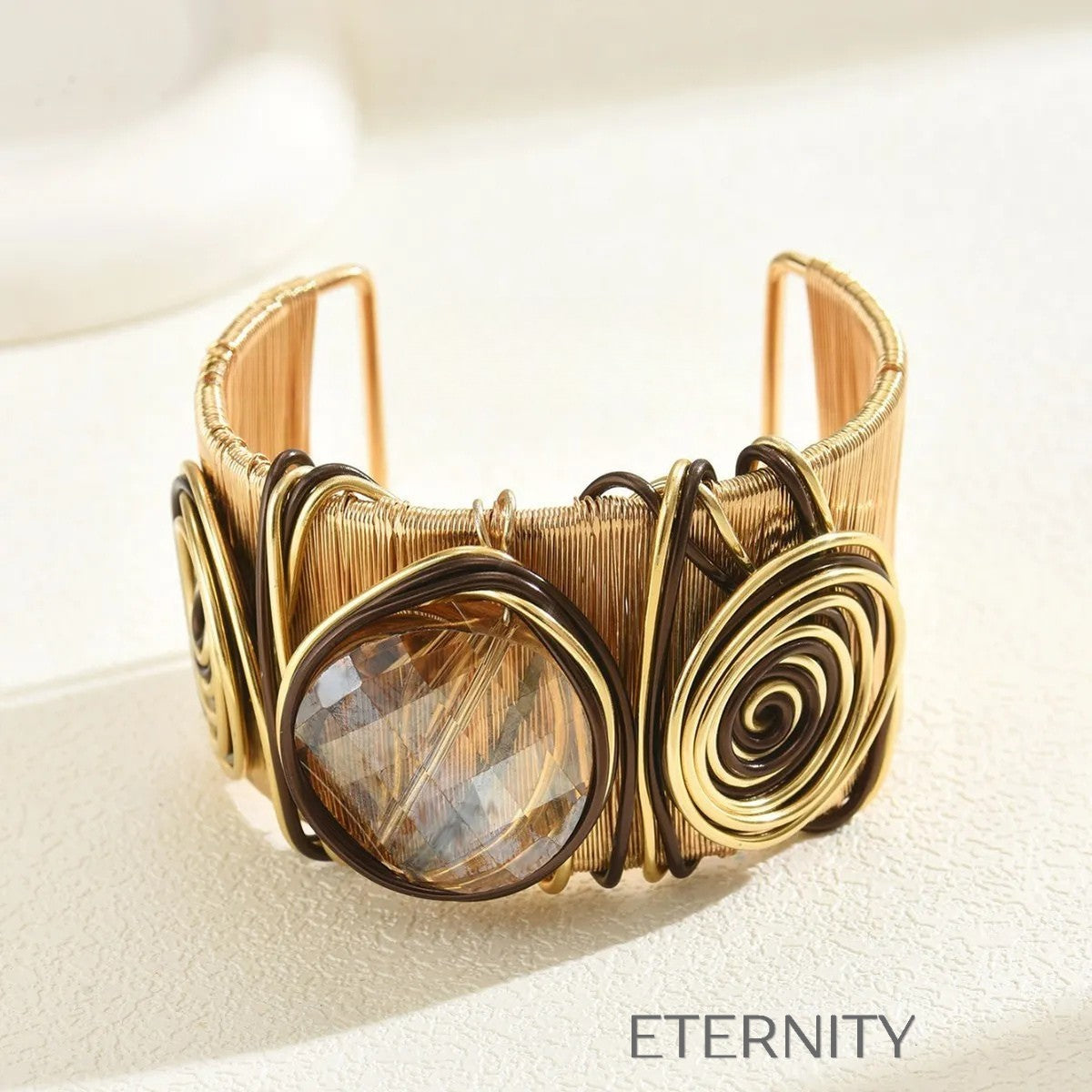 Brazalete Ethereal Spiral de Alambre Dorado y Piedra Central  Brazaletes Negro Unica Acero Inoxidable  ETERNITY