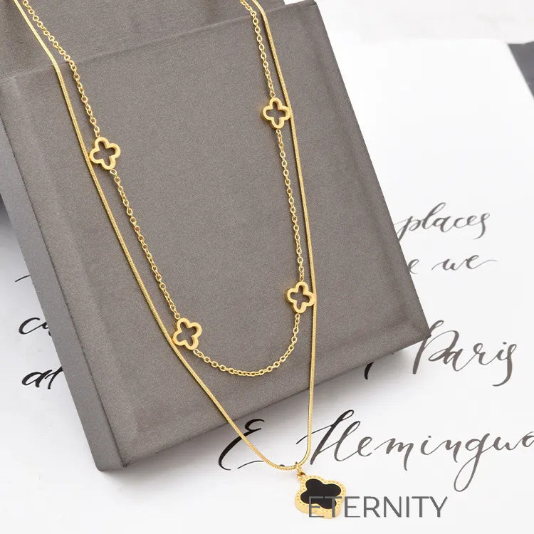 Collar Doble Eternal Lucky Clover en Oro con Esmalte Negro  Cadenas Dorado Unica Acero Inoxidable  ETERNITY