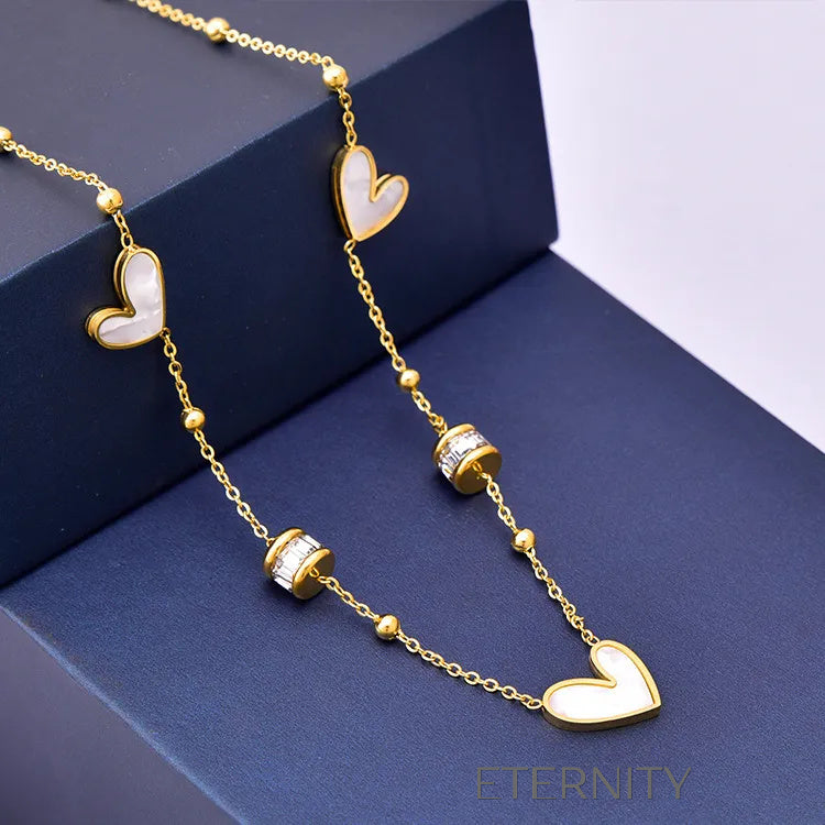 Collar Luminous Heart con Corazones de Nácar y Cilindros de Cristal  Cadenas Dorado Unica Acero Inoxidable  ETERNITY