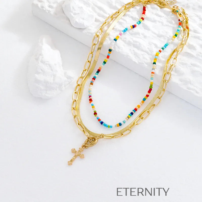 Set de collares dorados y de cuentas en capas con cruz Cadenas Dorado Unica Acero Inoxidable  ETERNITY