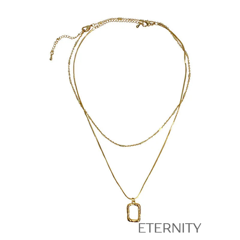 Collar de Doble Capa con Dije Geométrico Orgánico  Cadenas Dorado Unica Acero Inoxidable  ETERNITY