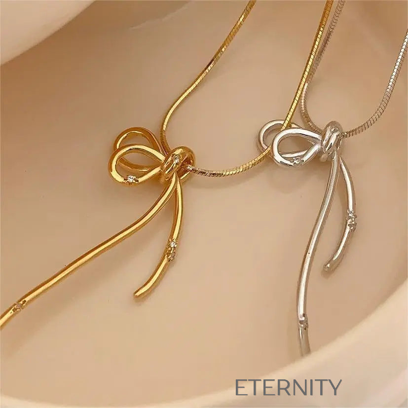 Collar Eternal Ribbon con Dije de Lazo Estilizado en Oro y Plata  Cadenas Plateado Unica Acero Inoxidable  ETERNITY