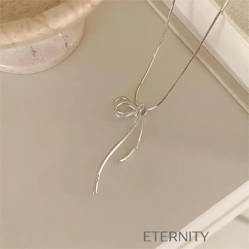 Collar Eternal Ribbon con Dije de Lazo Estilizado en Oro y Plata  Cadenas Plateado Unica Acero Inoxidable  ETERNITY