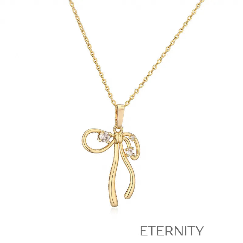 Colección de Collares Enchanted Bow con Dijes de Lazo en Perlas y Oro  Cadenas Dorado Unica Acero Inoxidable  ETERNITY