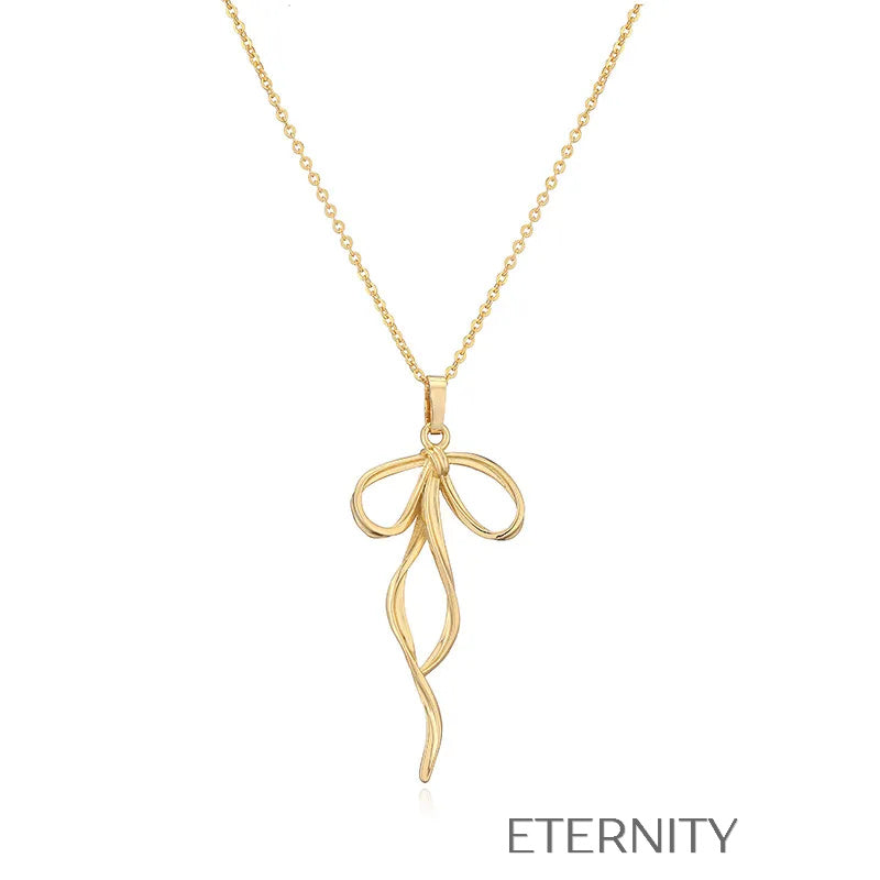Colección de Collares Enchanted Bow con Dijes de Lazo en Perlas y Oro  Cadenas Dorado Unica Acero Inoxidable  ETERNITY