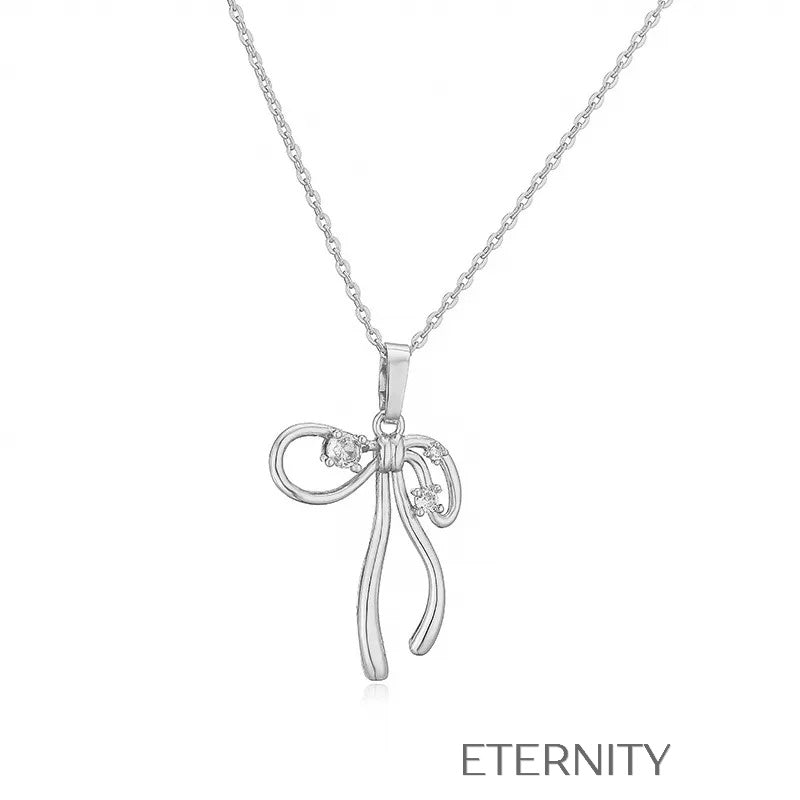 Colección de Collares Enchanted Bow con Dijes de Lazo en Perlas y Oro  Cadenas Dorado Unica Acero Inoxidable  ETERNITY