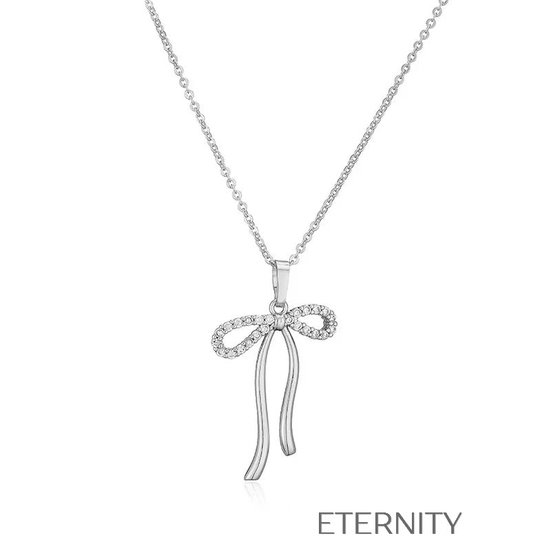 Colección de Collares Enchanted Bow con Dijes de Lazo en Perlas y Oro  Cadenas Dorado Unica Acero Inoxidable  ETERNITY