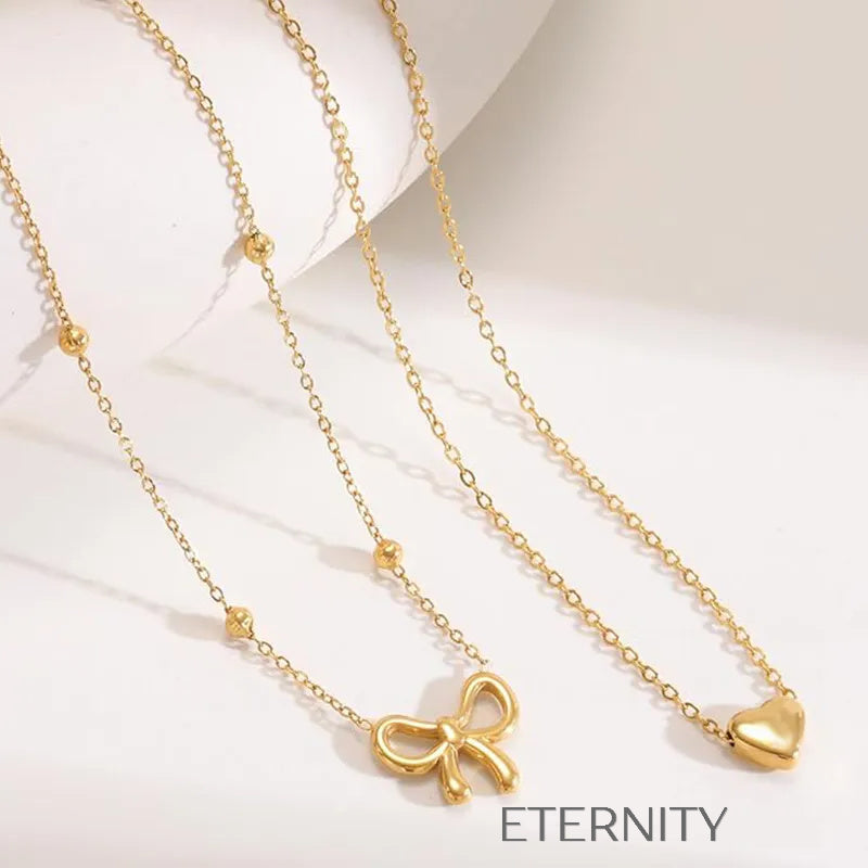 Collar Doble Coquette Love Corazón y Lazo  Cadenas Dorado Unica Acero Inoxidable  ETERNITY