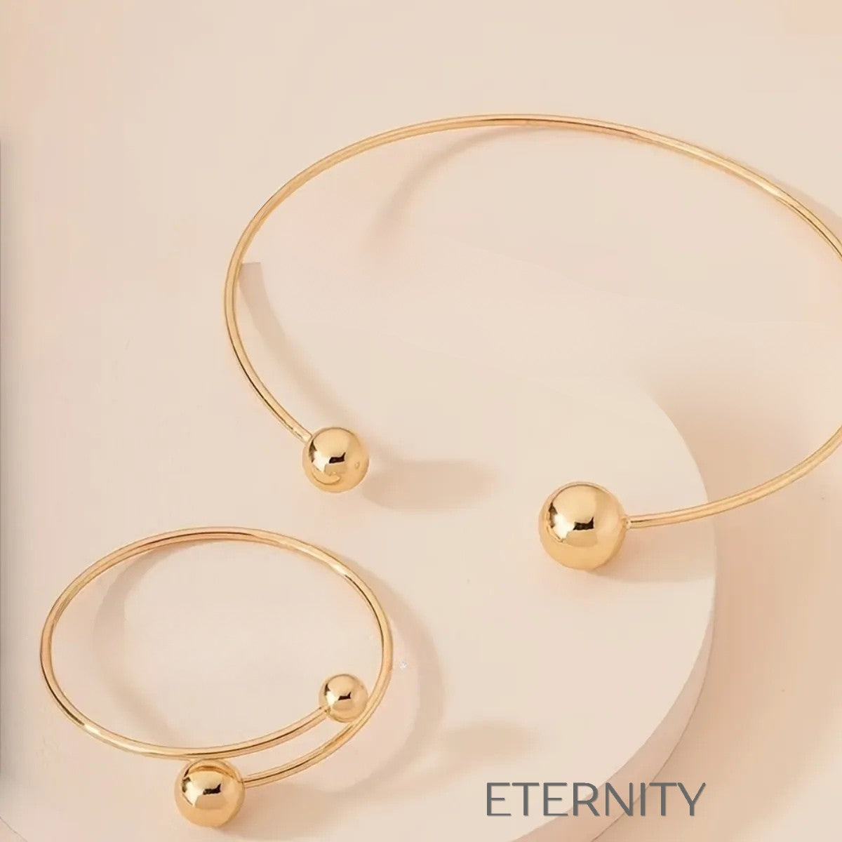 Conjunto Orbital Harmony de Gargantilla y Pulsera Rígida con Esferas en Acero  Set Dorado Unica Acero Inoxidable  ETERNITY