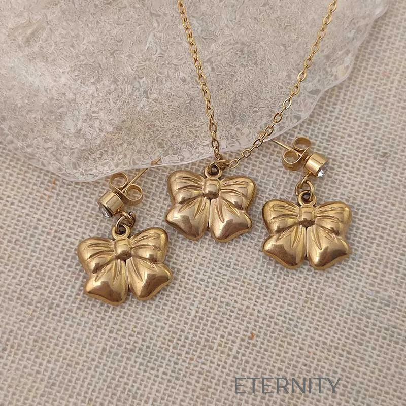 Set de Collar y Zarcillos Charming Bow con Diseño de Lazo Escultural  Set Dorado Unica Acero Inoxidable  ETERNITY