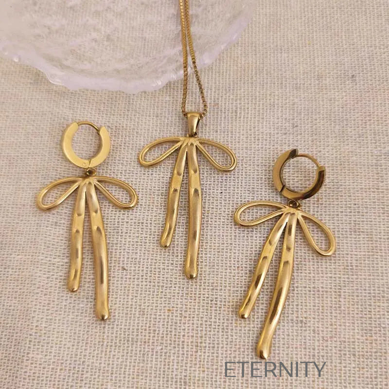 Set de collar y aretes con diseño de lazo elegante Set Dorado Unica Acero Inoxidable  ETERNITY