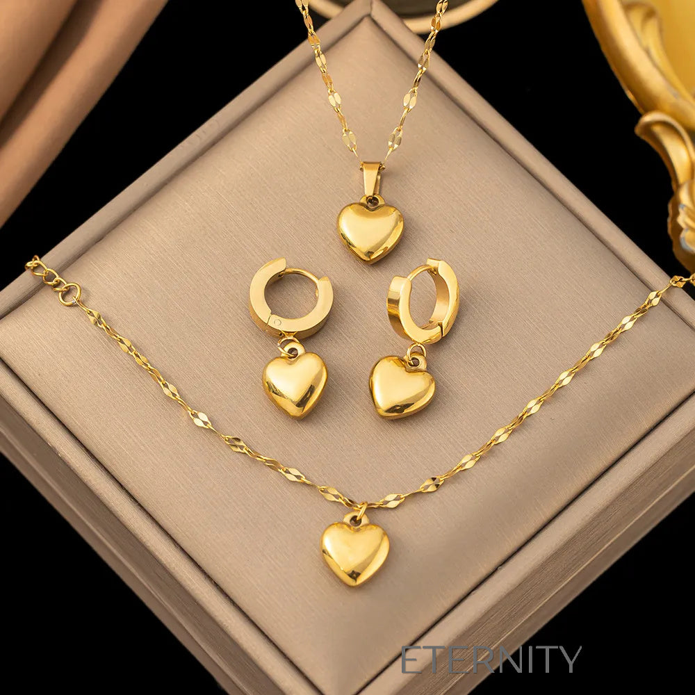 Set Luxe Heart de Collar Pulsera y Zarcillos con Dijes de Corazón en Oro  Set Dorado Unica Acero Inoxidable  ETERNITY
