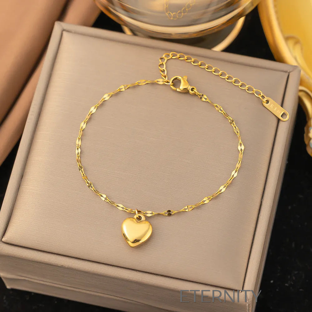 Set Luxe Heart de Collar Pulsera y Zarcillos con Dijes de Corazón en Oro  Set Dorado Unica Acero Inoxidable  ETERNITY