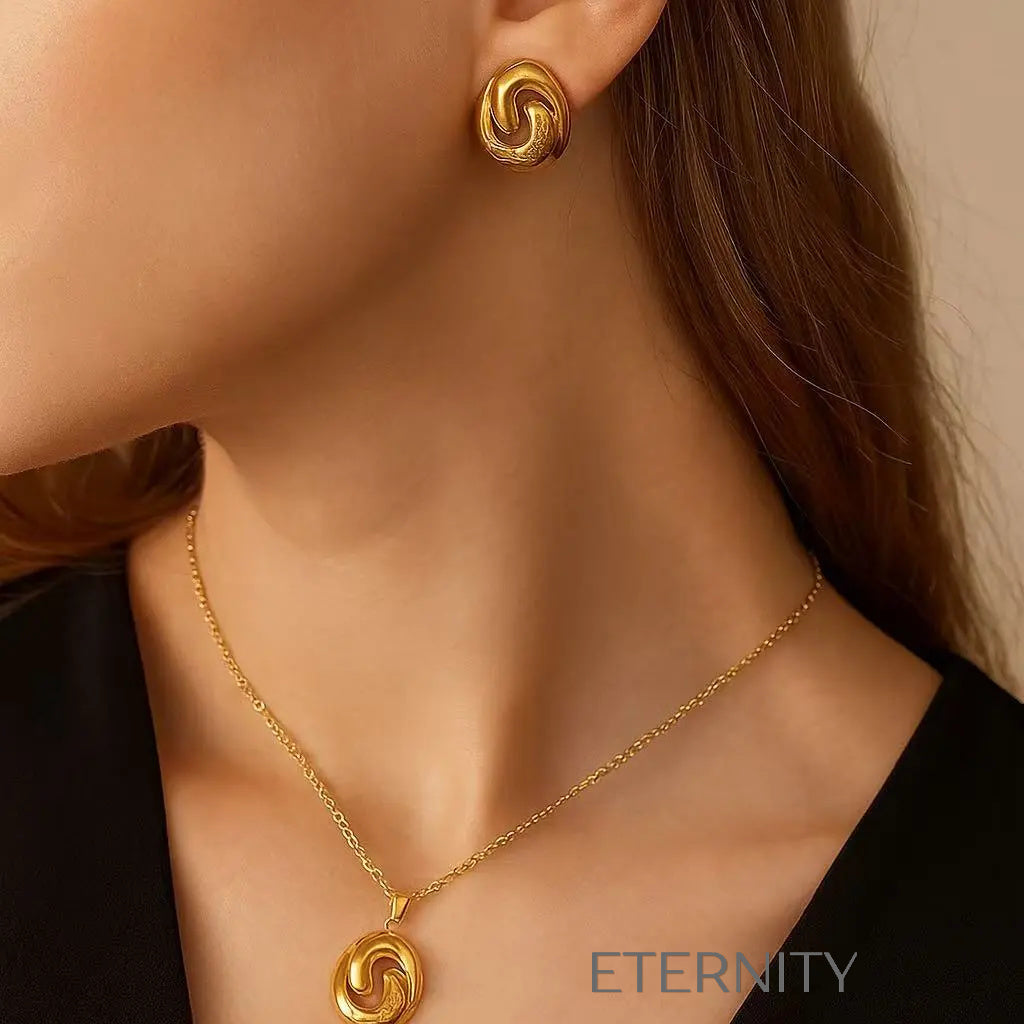 Conjunto de Collar y Zarcillos Eternal Swirl en Oro Pulido  Set Dorado Unica Acero Inoxidable  ETERNITY