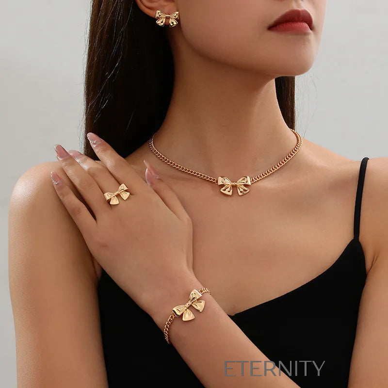 Conjunto Coquette Ribbon Lazos Dorados  Set Dorado Unica Acero Inoxidable  ETERNITY