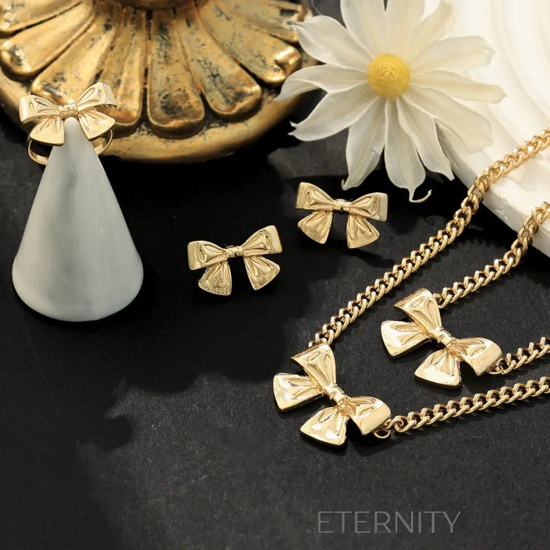 Conjunto Coquette Ribbon Lazos Dorados  Set Dorado Unica Acero Inoxidable  ETERNITY