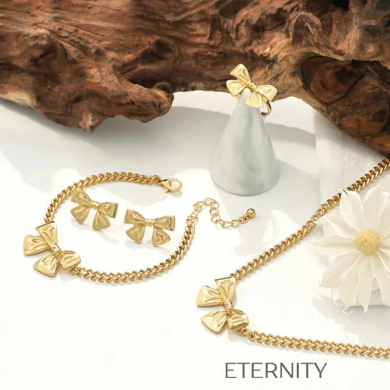 Conjunto Coquette Ribbon Lazos Dorados  Set Dorado Unica Acero Inoxidable  ETERNITY