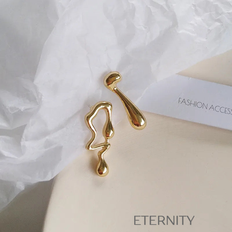 Zarcillos Liquid Essence Oro  Zarcillos Dorado Unica Acero Inoxidable  ETERNITY