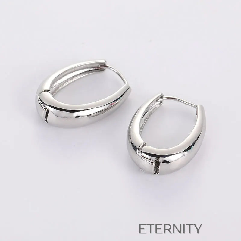 Zarcillos de Aro Ethereal Oval con Diseño Ergonómico y Acabado Espejo  Zarcillos Dorado Unica Acero Inoxidable  ETERNITY