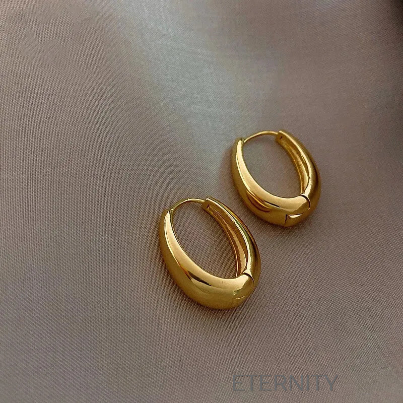 Zarcillos de Aro Ethereal Oval con Diseño Ergonómico y Acabado Espejo  Zarcillos Dorado Unica Acero Inoxidable  ETERNITY