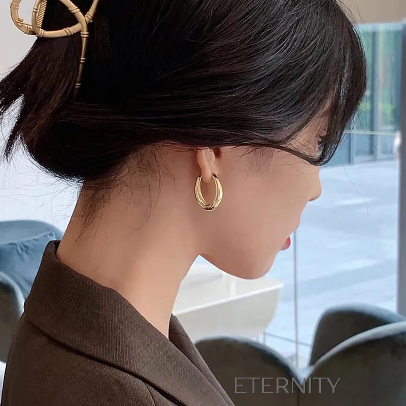 Zarcillos de Aro Ethereal Oval con Diseño Ergonómico y Acabado Espejo  Zarcillos Dorado Unica Acero Inoxidable  ETERNITY