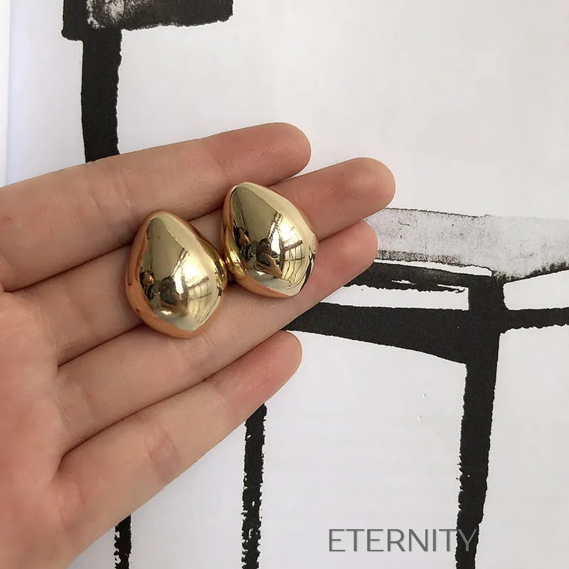 Zarcillos Gota Escultórica  Zarcillos Dorado Unica Acero Inoxidable  ETERNITY