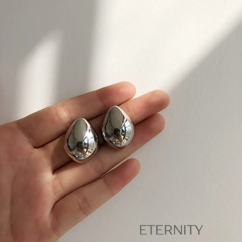 Zarcillos Gota Escultórica  Zarcillos Dorado Unica Acero Inoxidable  ETERNITY
