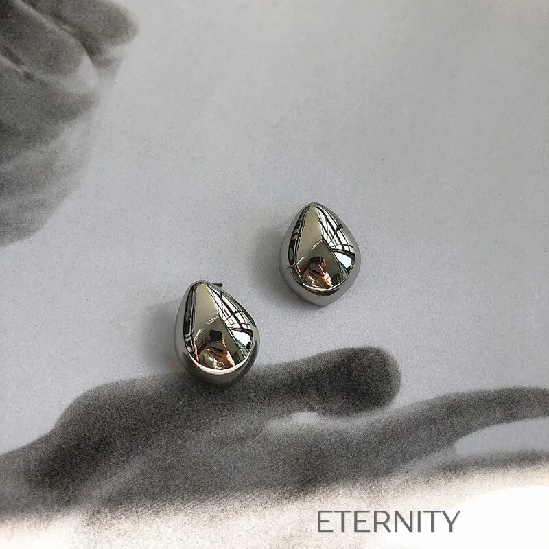 Zarcillos Gota Escultórica  Zarcillos Dorado Unica Acero Inoxidable  ETERNITY