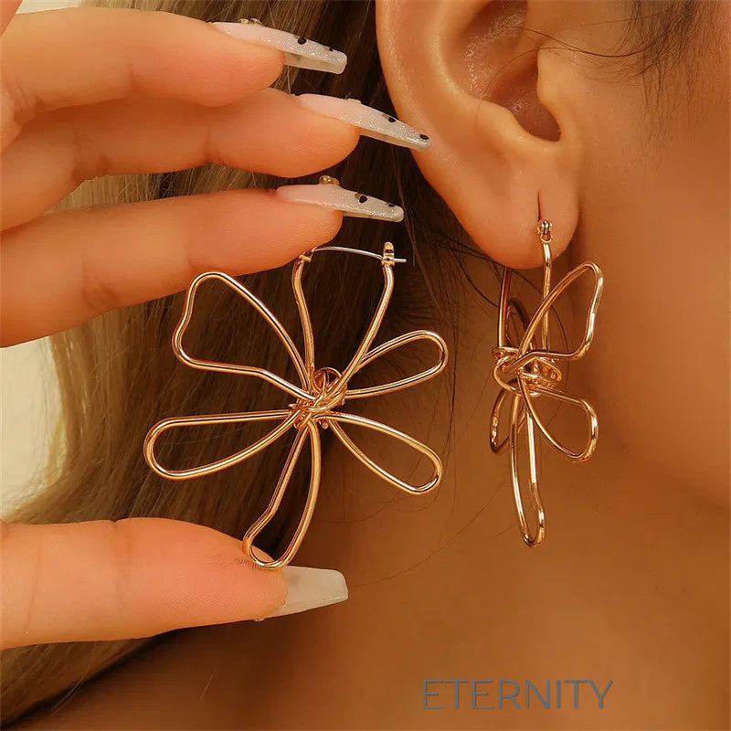 Aretes dorados con diseño artístico floral Zarcillos Dorado Unica Acero Inoxidable  ETERNITY
