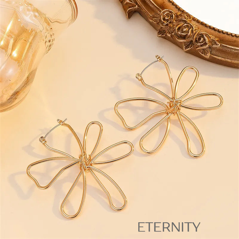 Aretes dorados con diseño artístico floral Zarcillos Dorado Unica Acero Inoxidable  ETERNITY